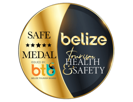 A gold medal emblem featuring "Safe Medal" and "Belize Tourism Health & Safety" text.